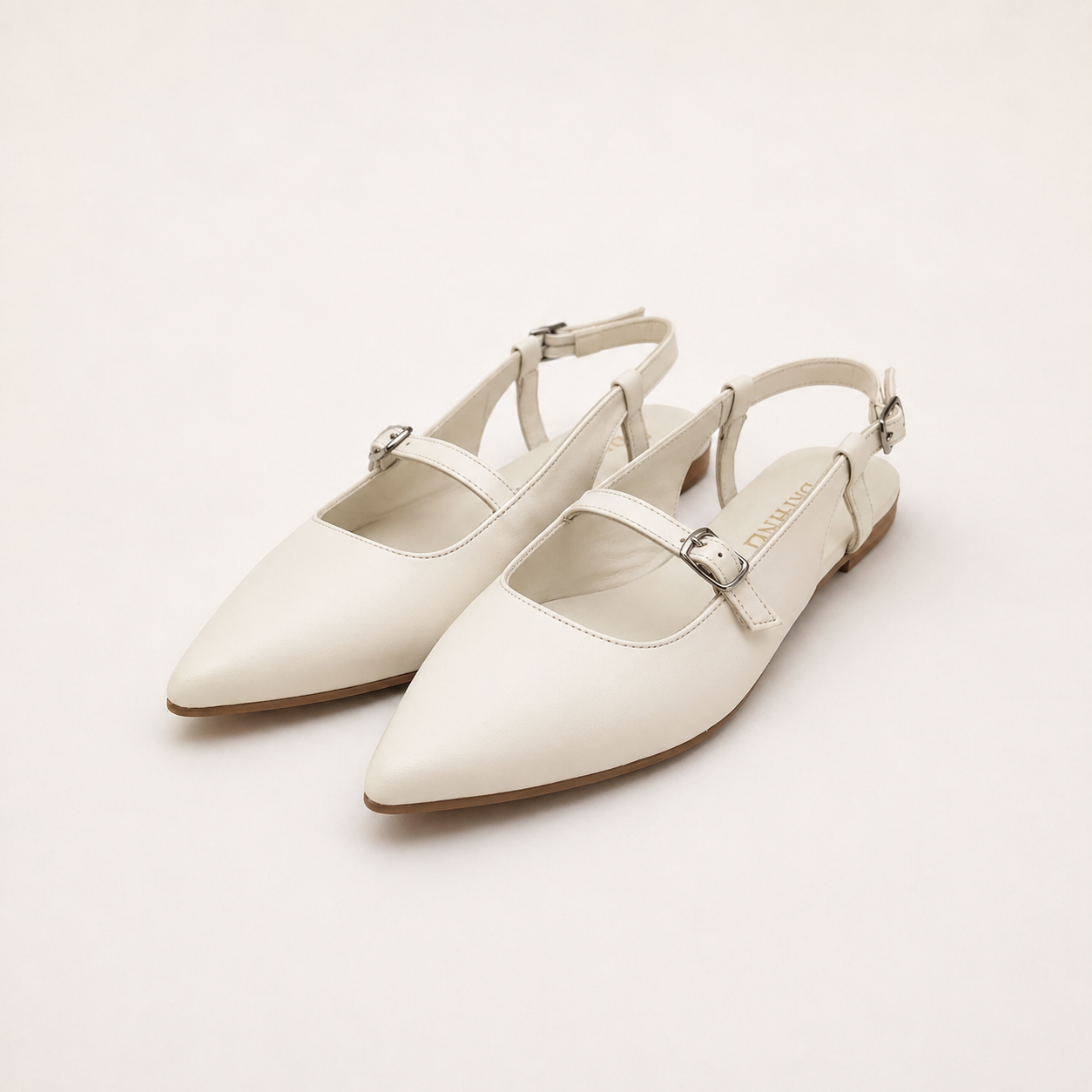 Slingback a punta con cinturini